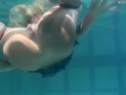 Blonde Feher with big firm tits underwater